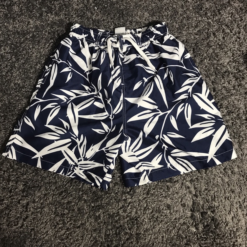 Palm tree or floral swimming trunks